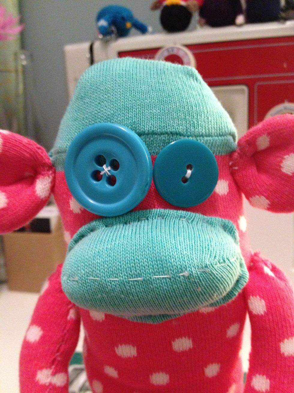 Sew on some odd shaped or unusual buttons to give your monkey character.
