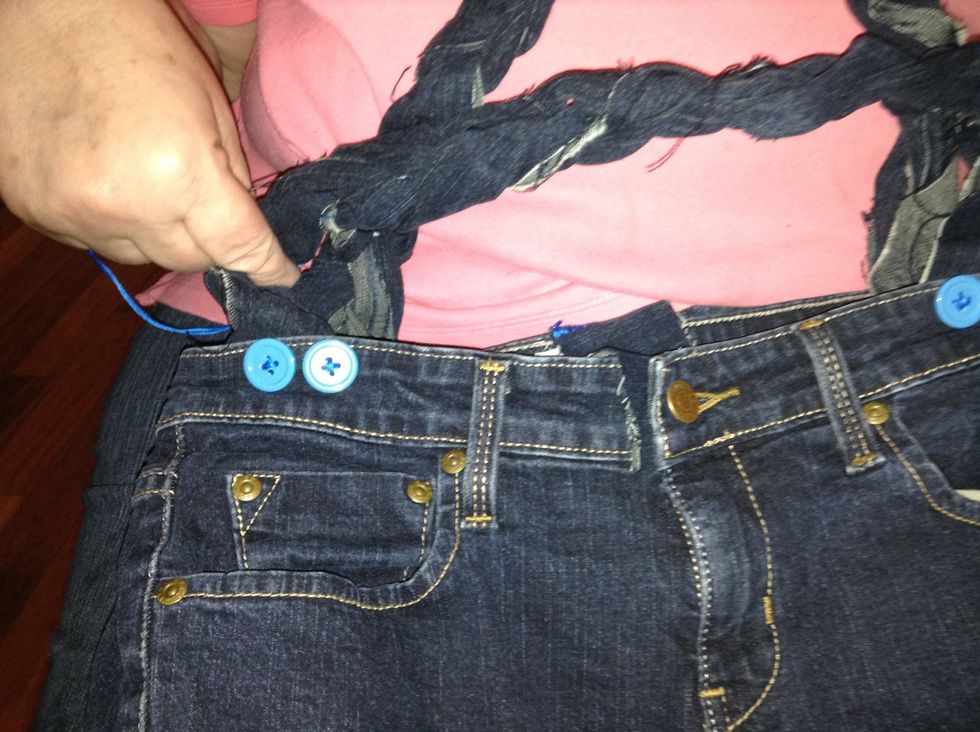 Sew on the braided strips. I added buttons to mine