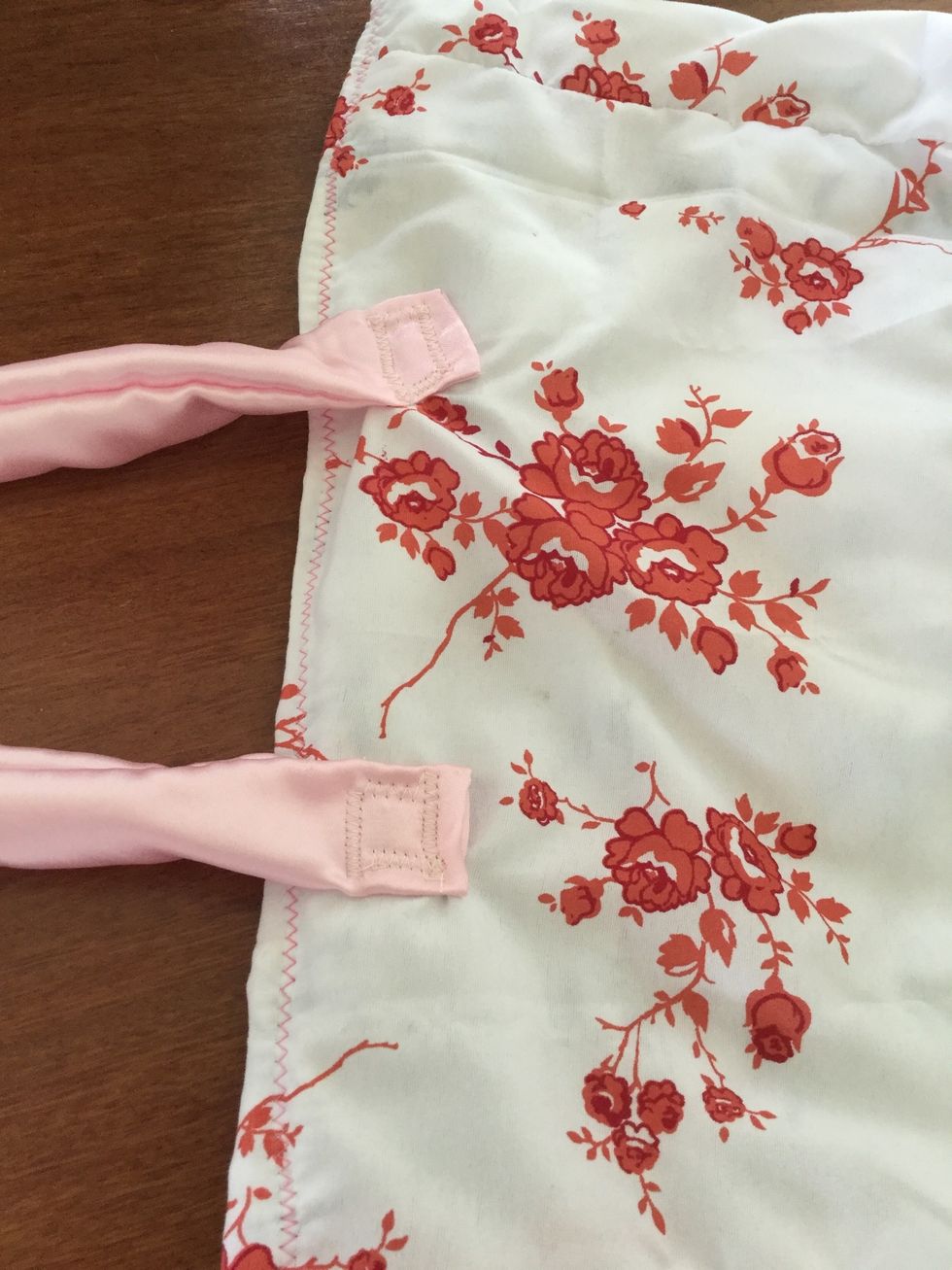 Sew on the handles 8cm from the corner and 5cm down from the top of the bag. Use a big zig-zag stitch and sew a square onto the end of the handle. This will help it to carry heavy loads at one time.