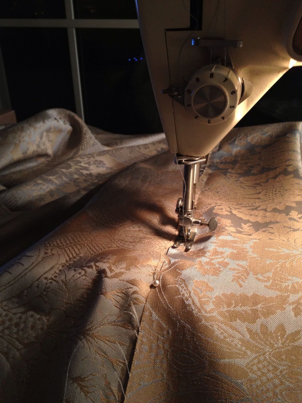 Sew pinned hemline a little in from the cut about a 1/2 inch. Choose a measurement and be consistent so the bottom is straight.