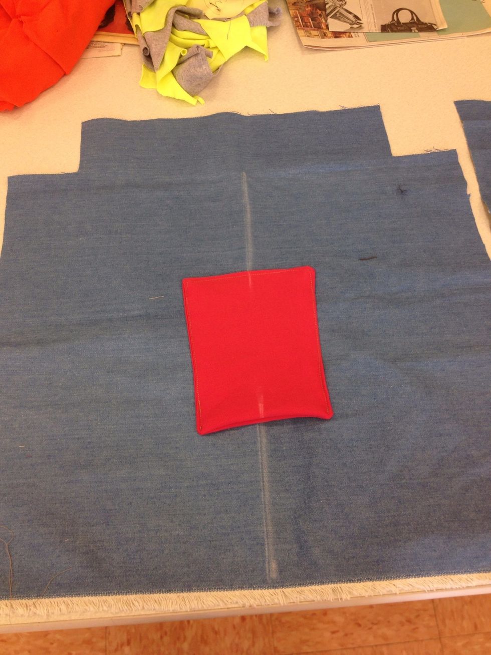 Sew pocket on to liner fabric with opening of pokey on bottom. Sew 3 sides of pocket, leaving top of pocket open for use.