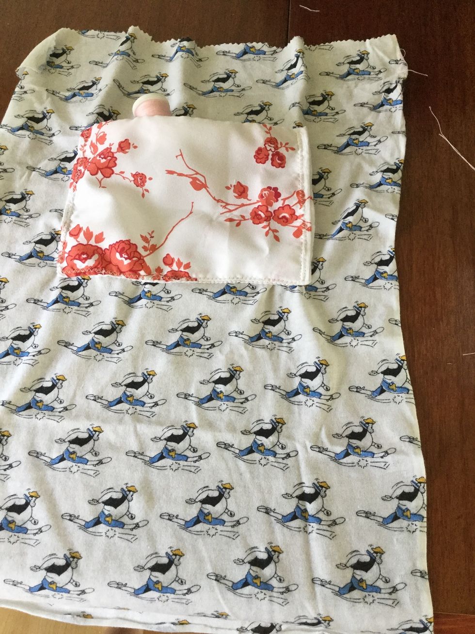Sew pocket onto bag panel lining. Use a zig-zag stitch for decoration.