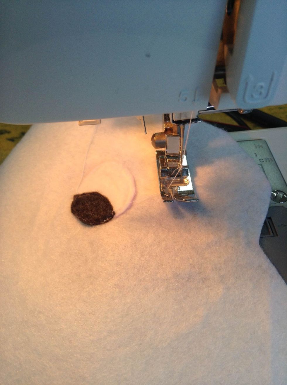 Sew the accessories on the front and back of the monster\u2019s body.