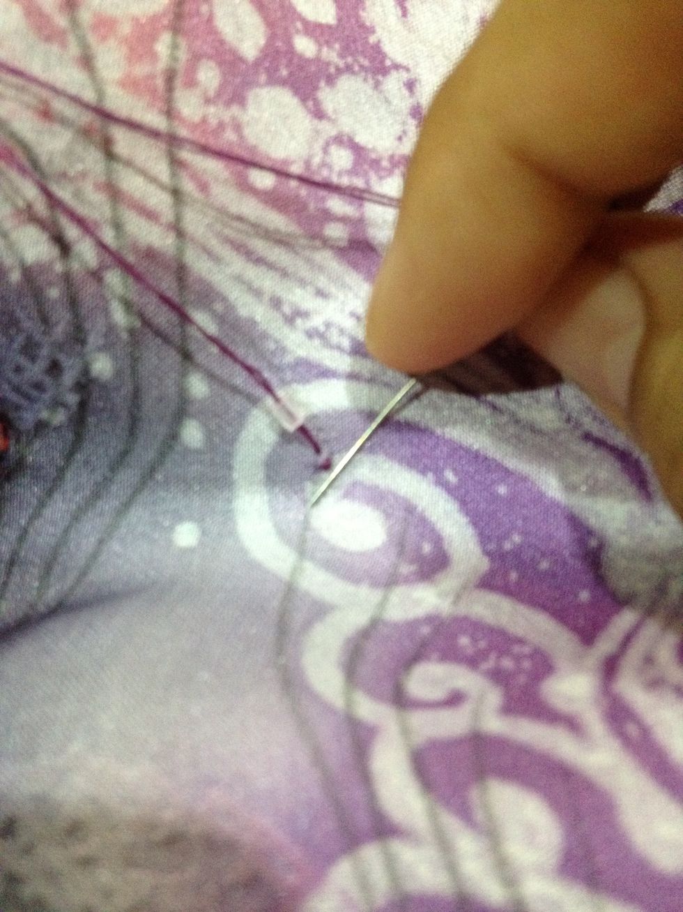 Sew the bead by following the lines of the design