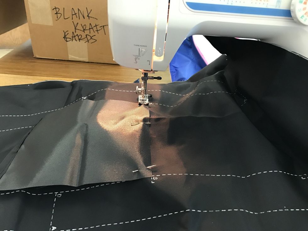 Sew the bottom of the pocket to the bag at 3/8" (line raw edge of pocket up with right side of presses foot) back stitch at top and bottom