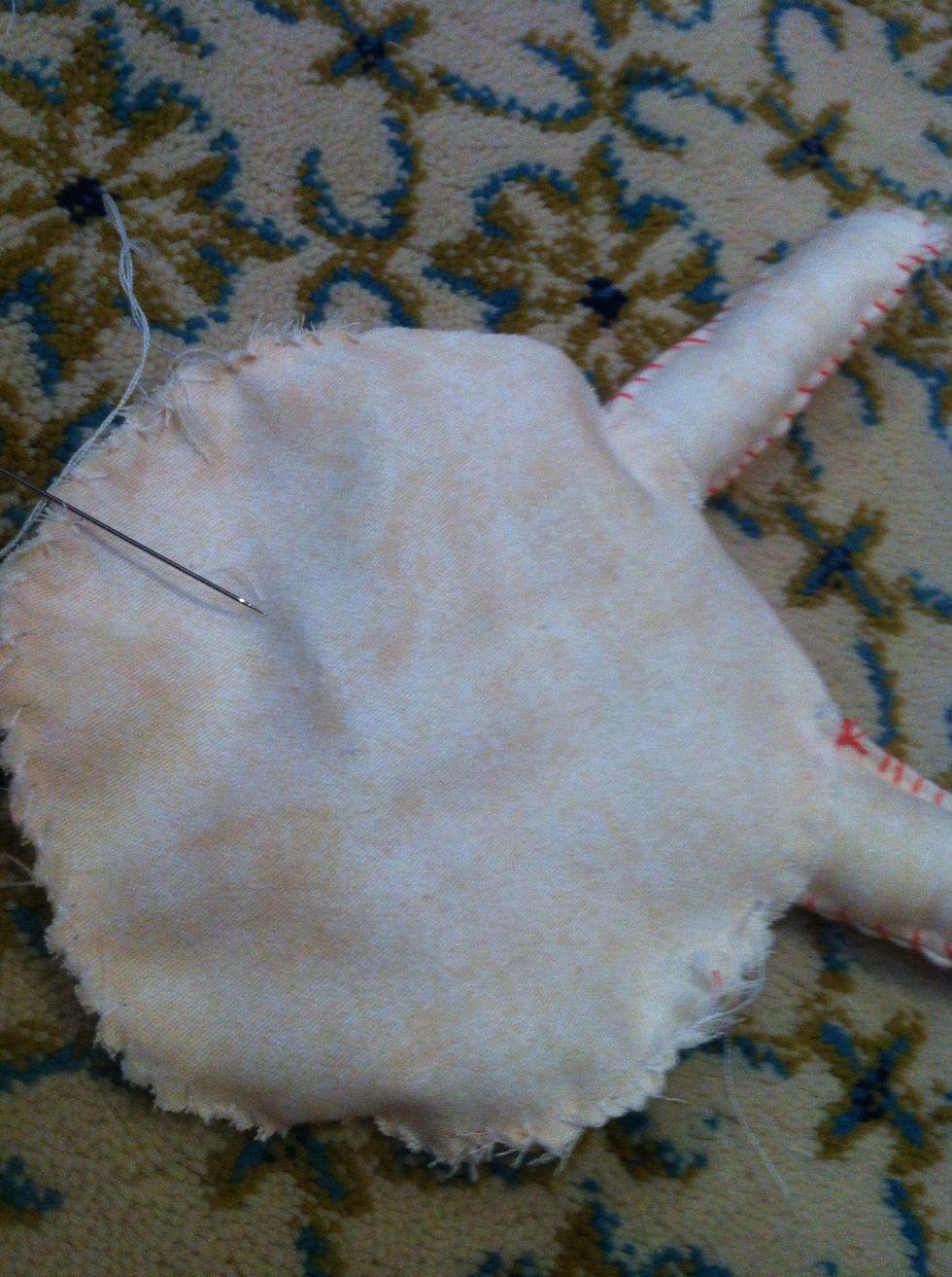 Sew the face with thread that have the same color of the cloth ( don't forget to not sew all the places make a small please to put the cotton inside then sew it)