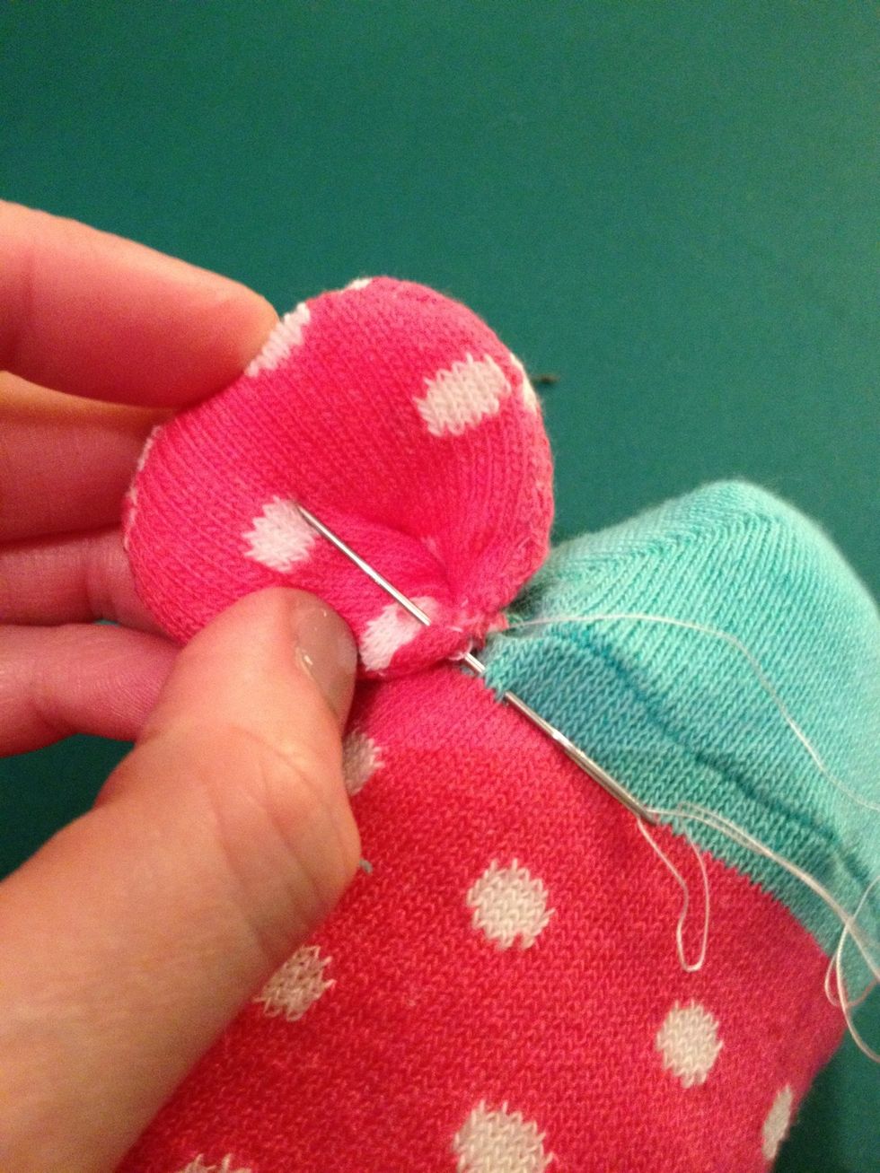 Sew the finished ears onto the side of the head.