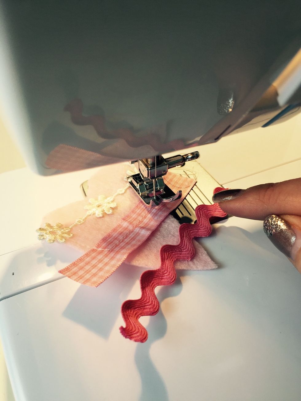 Sew them down. Staring with the first one then move to the second one without lifting your needle. Watch video in the next step.