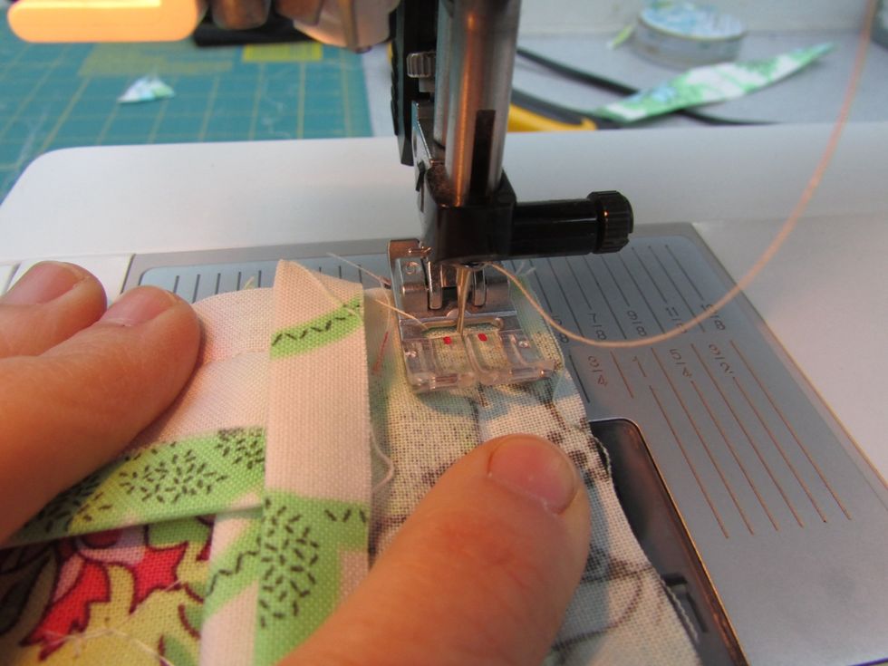 Sew this short edge (the one with the tiny pocket you basted before), using scant 1/2" seams. Repeat this process around the next three corners and sides.