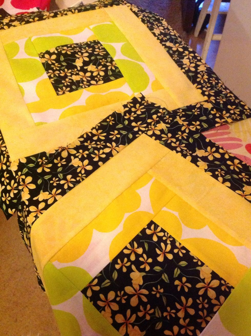 Sew two cottage blocks.