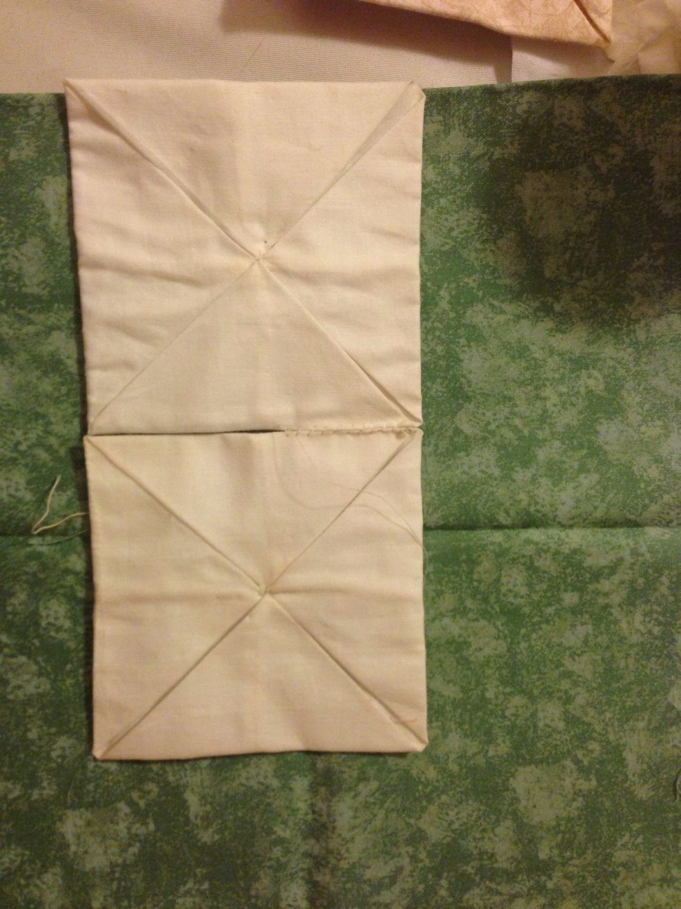 Sew two squares together in the middle.