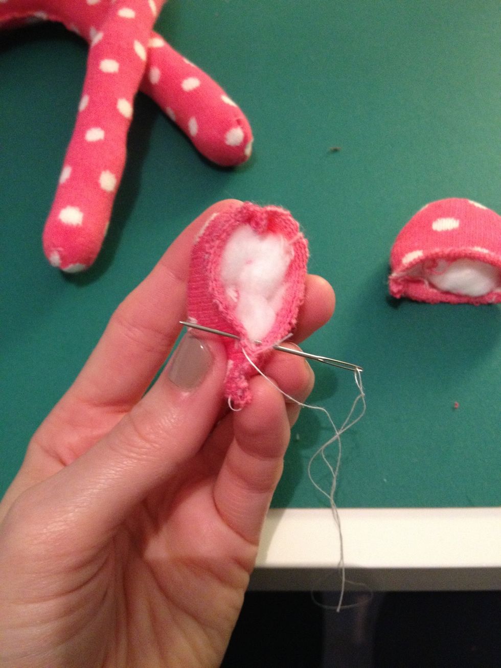 Sew up the bottom of the ears