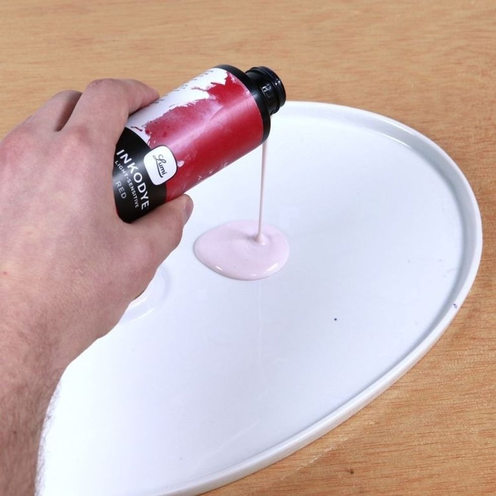 Shake bottle well. Pour Inkodye into a bowl or flat, non-absorbent surface. Do steps 4-9 & 12 in a room with subdued lighting -exposure to lots of natural light will begin Inkodye's color development