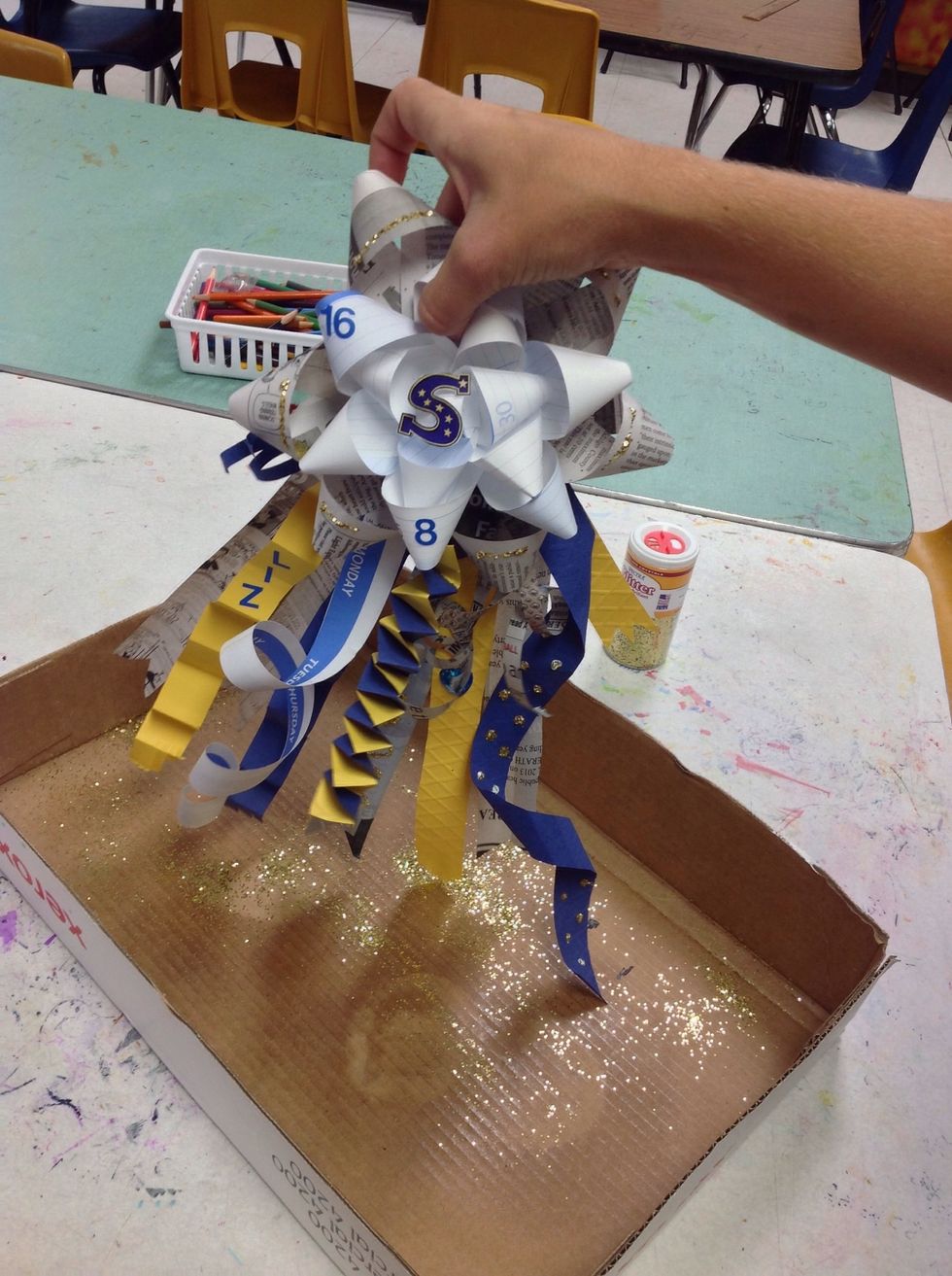 Shake it out over glitter box. Can you guess the purpose of the glitter box?