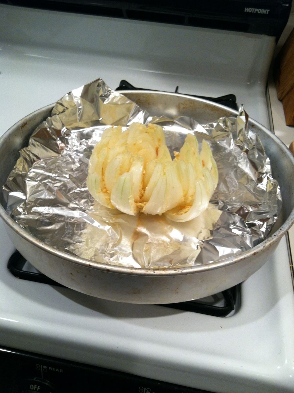 Shake out the excess breadcrumbs or toppings. Put the onion on foil on a cookie sheet or similar surface.