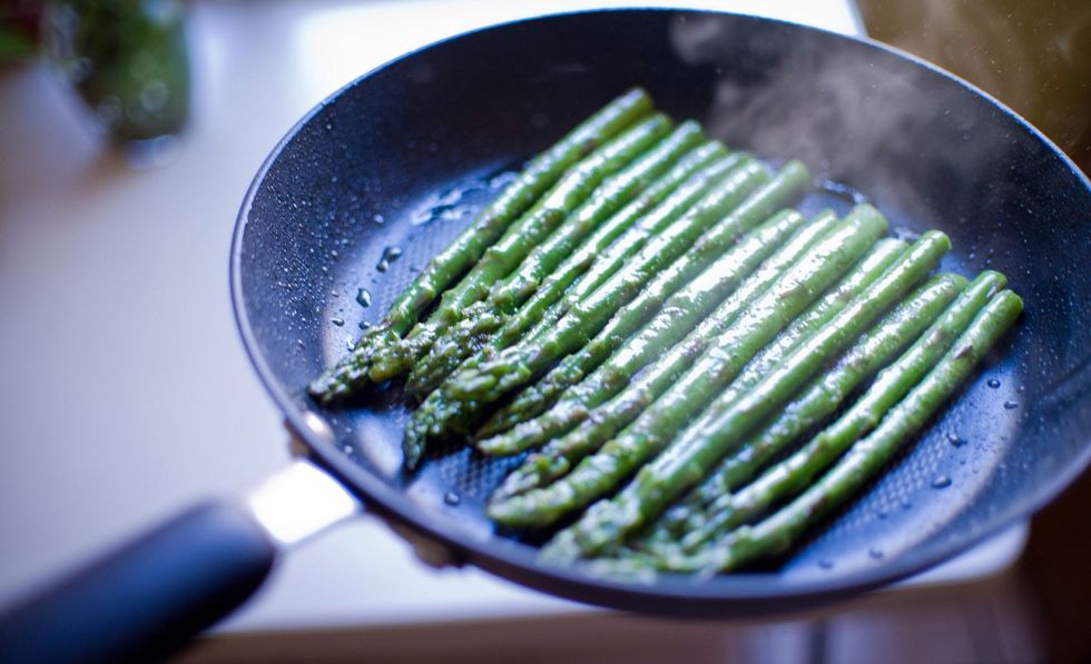 Shake shake shake!!!!! Carefully toss your asparagus around to saut\u00e9 properly. I used a spatula in addition to help keep it all together and to fully turn it. Continue process for 4 minutes. Heat!!!!