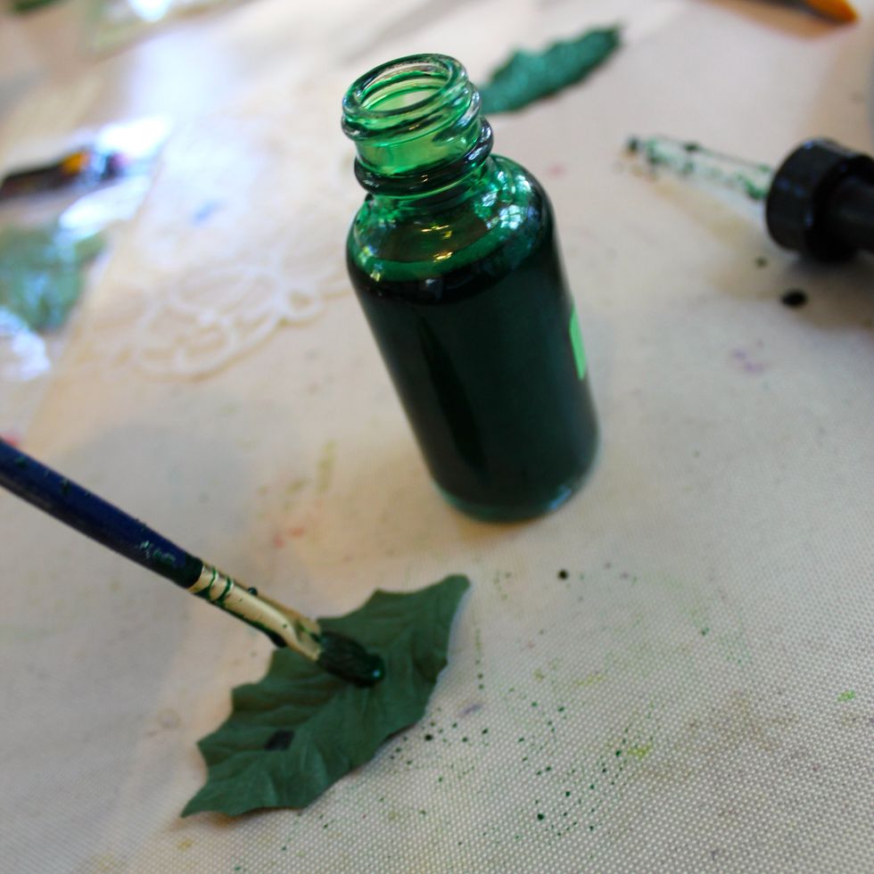 Shake the bottle very well. Remove the dropper and then use a brush to add the Minx to the leaves.