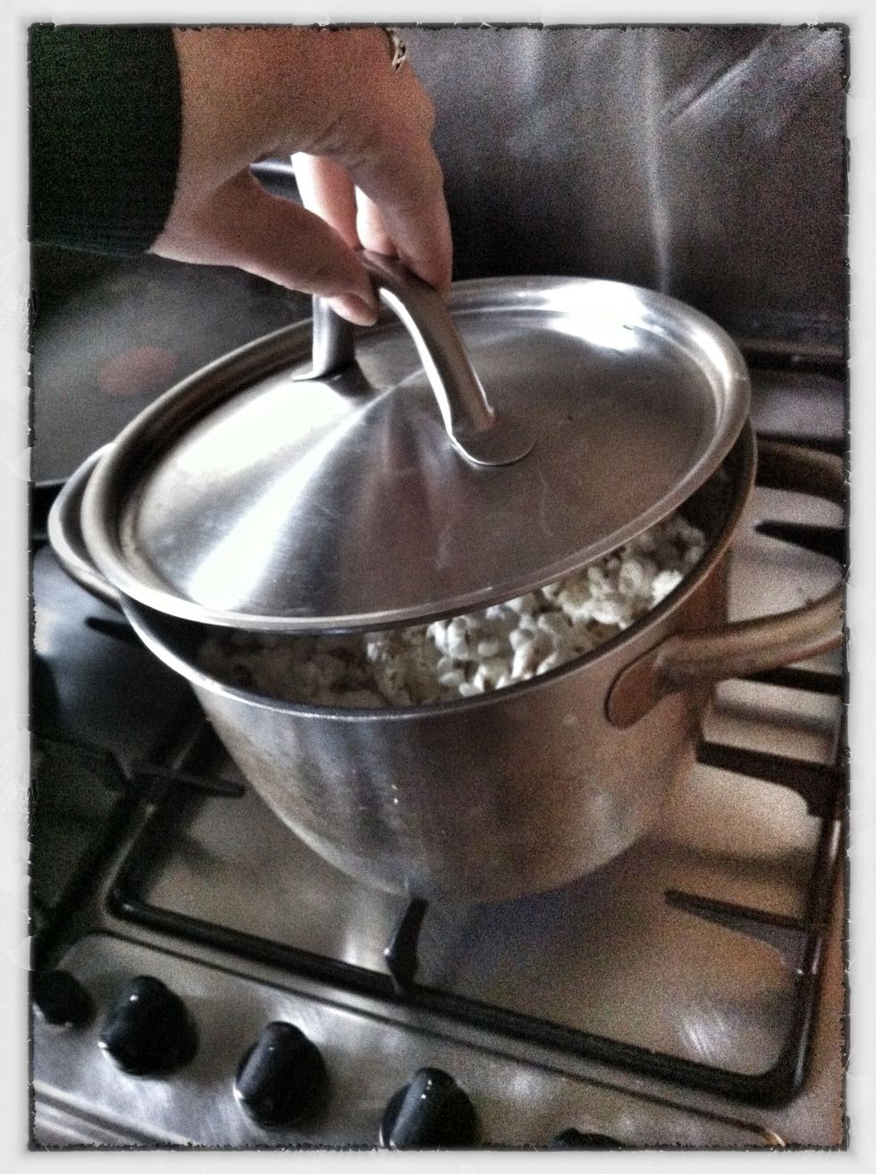Shake the pot and open the lid slightly while this is happening to let steam out and avoid burning.