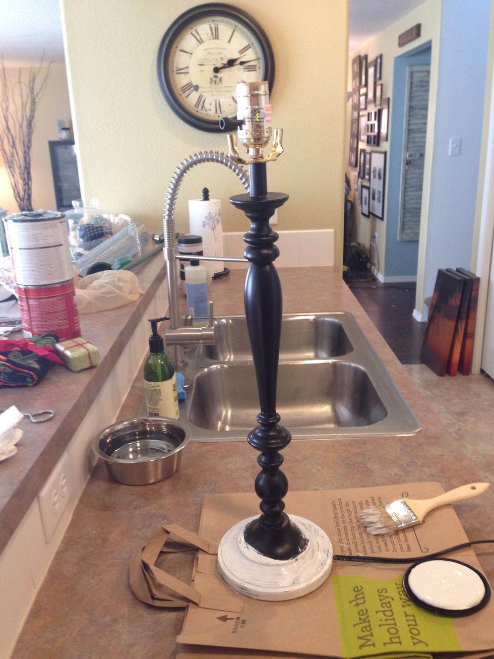 Shake up your paint and start painting your first coat on the entire lamp base. I usually go with the curves when it's not a straight piece. As you can tell I just paint anywhere I have enough room.