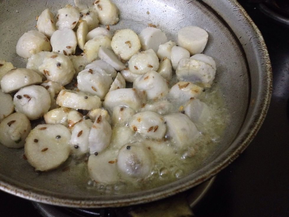 Shallow fry the Arbi with cumin seeds and mustard seeds..