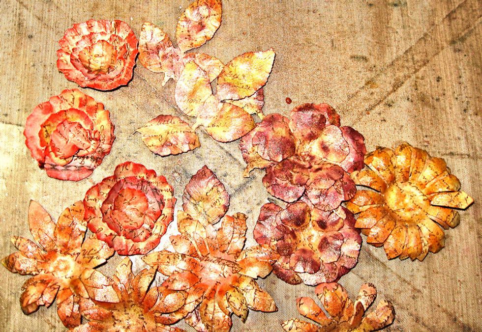 Shape flowers with foam mat and ball stylus. Sponge edges with ink to create definition. Layer together with hot glue. Brush pumpkins, trophy, acorns with copper texture paste. Now we assemble!