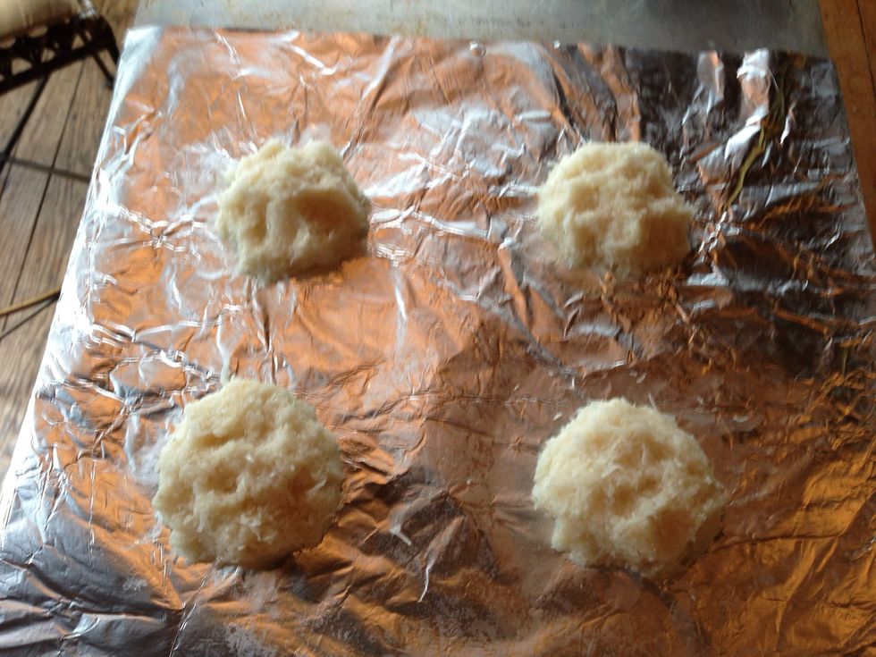 Shape into a half tennis ball size. Lay on sheet.