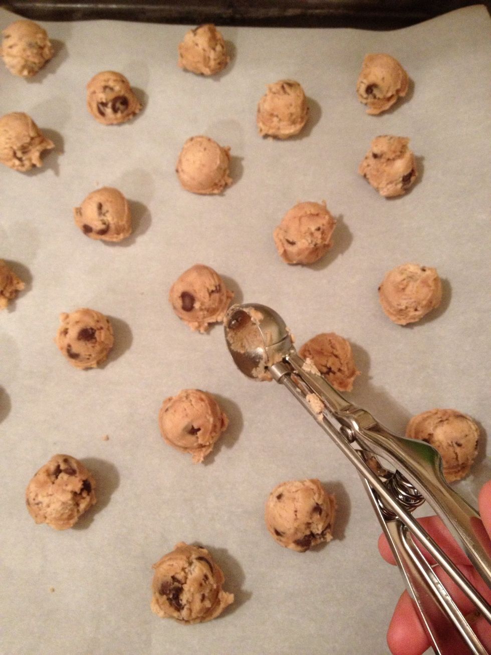 Shape into small balls using your hands or a small ice-cream scooper, and place them on a baking tray.