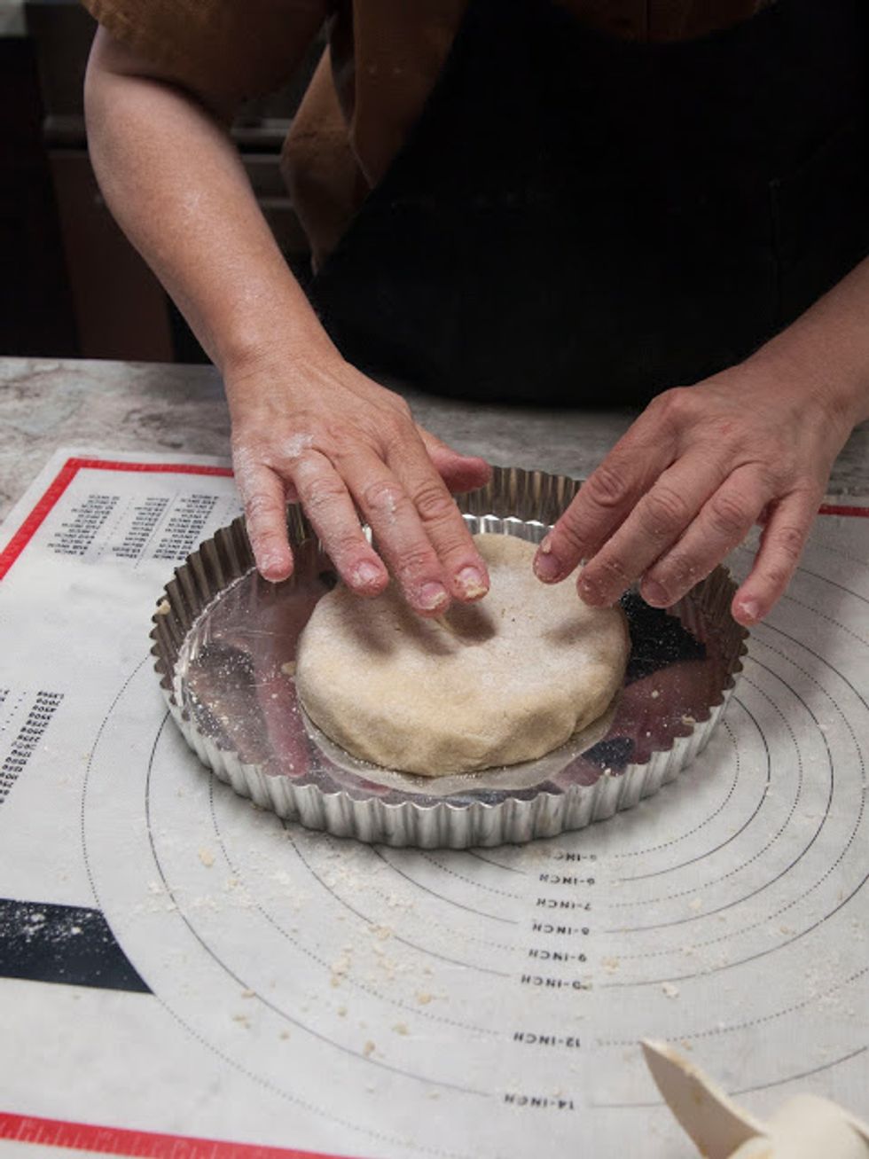 Shape it into a 5 inch disc and put it in the center of your tart pan...or divide it into 5 parts and use individual small tart pans