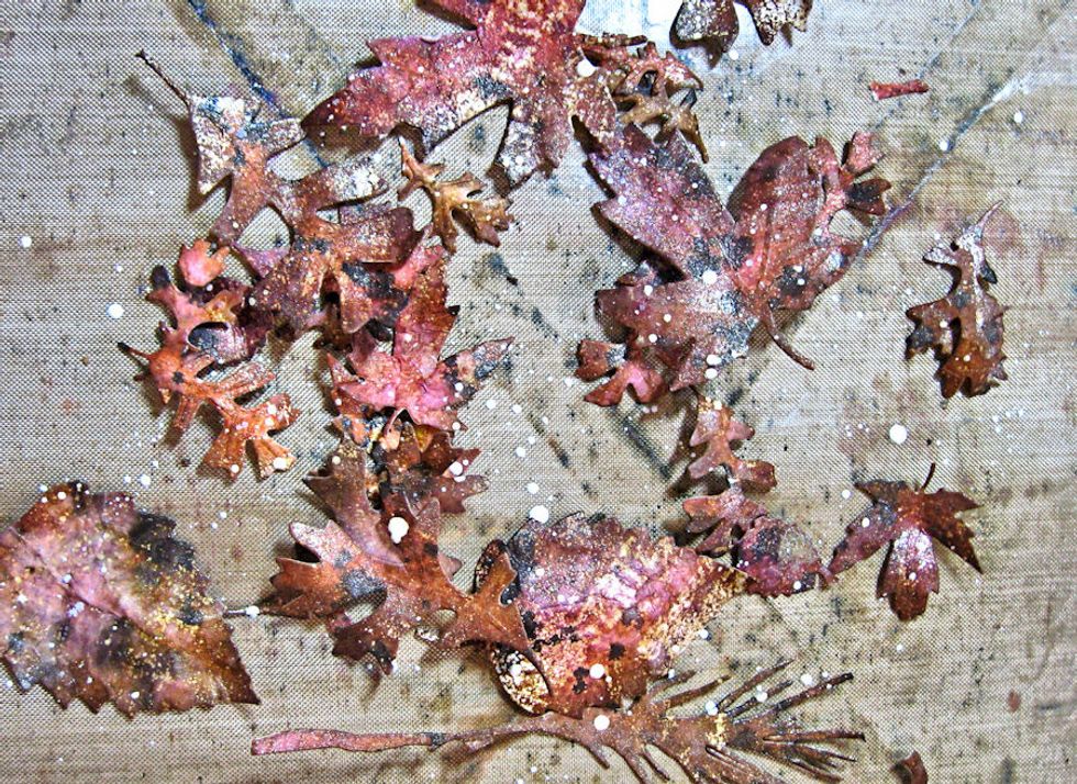 Shape moist leaves with a stylus and foam pad. The water will make the fibers easier to manipulate and the  leaves will hold their shape when dry.  Spatter with diluted white paint. Gently heat dry.