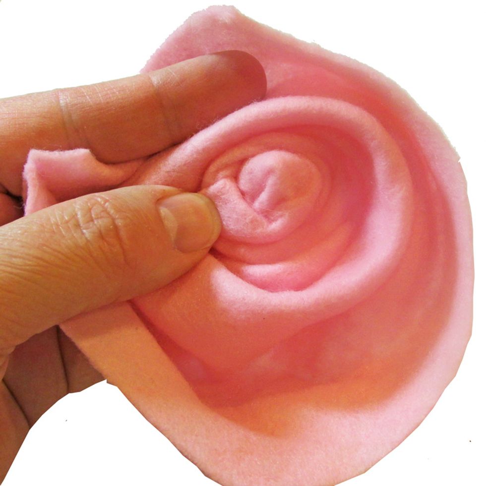 Shape the flower as you fold the raw edges under.