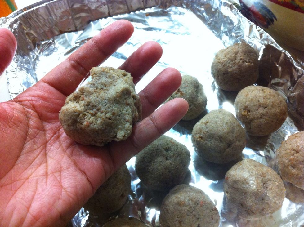 Shape them into round balls. Really push them together with your palms to make a tight/solid ball. Tip: wash hands often to prevent cake from getting stuck on your hands. Place in freezer for 10mins.