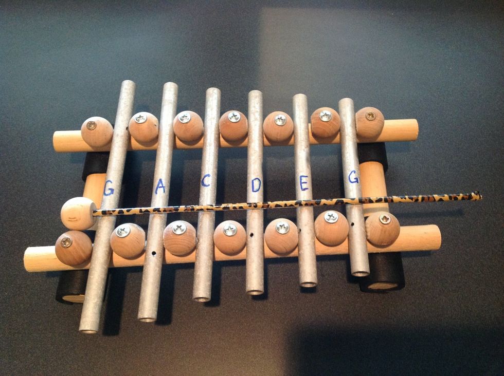 She and her dad figured out which note each chime played and she marked it on the chime and also on the base.