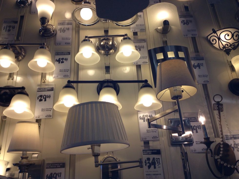 Shopping at Home Depot I found a light fixture for around $40 and they let me use a Lowe's coupon to get a discount off of the total price.