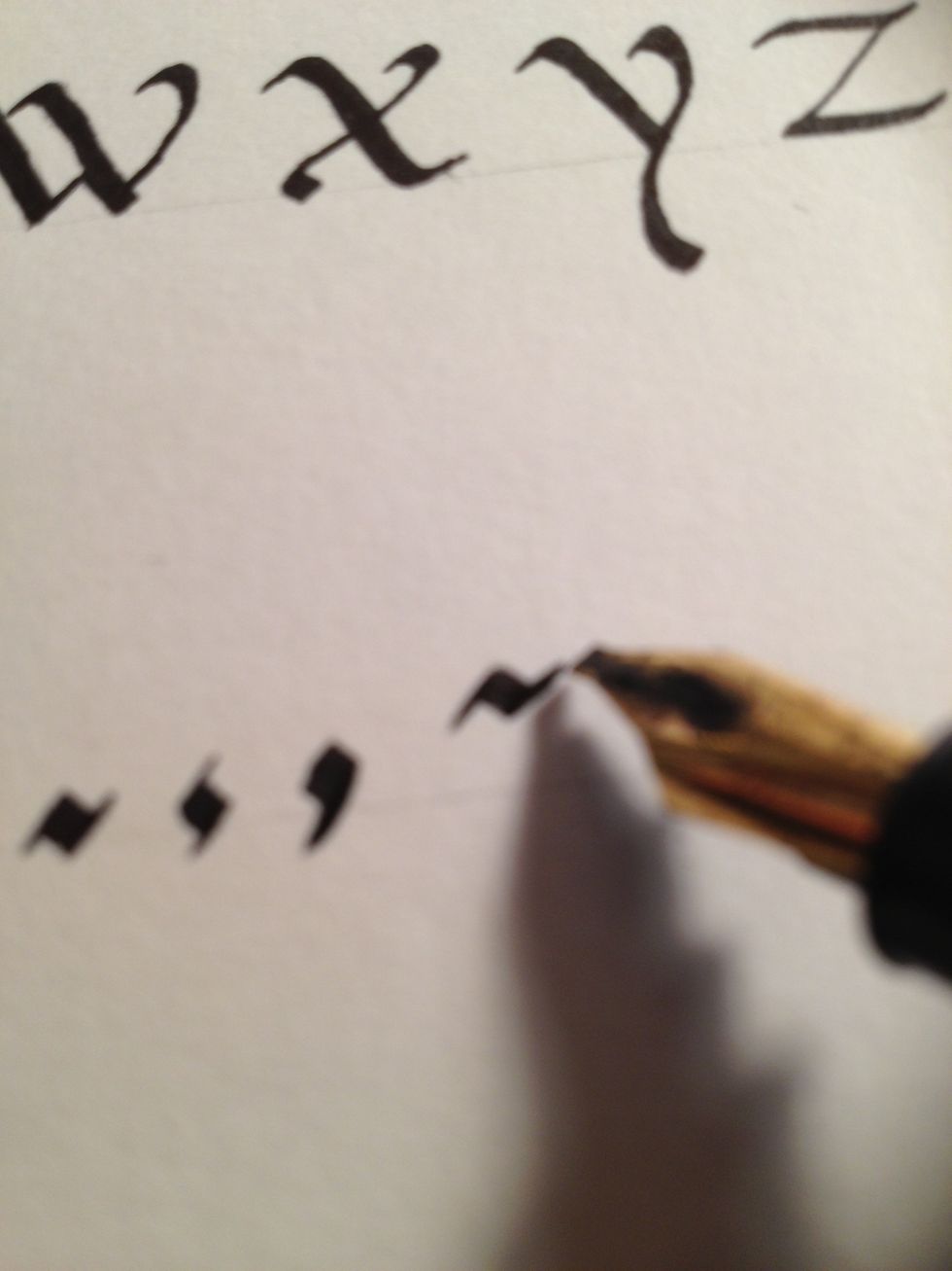 Short dashes are slightly stretched flourished periods, placed halfway between top and bottom.