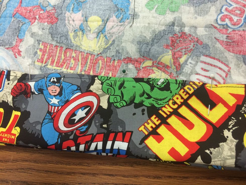 Should be 1 1/2" down. Make sure the webbing straps lay flat inside. Pull the straps out through the opening (hole) in the opposite seams. (see Mrs. Clark for this step- it can be confusing!)