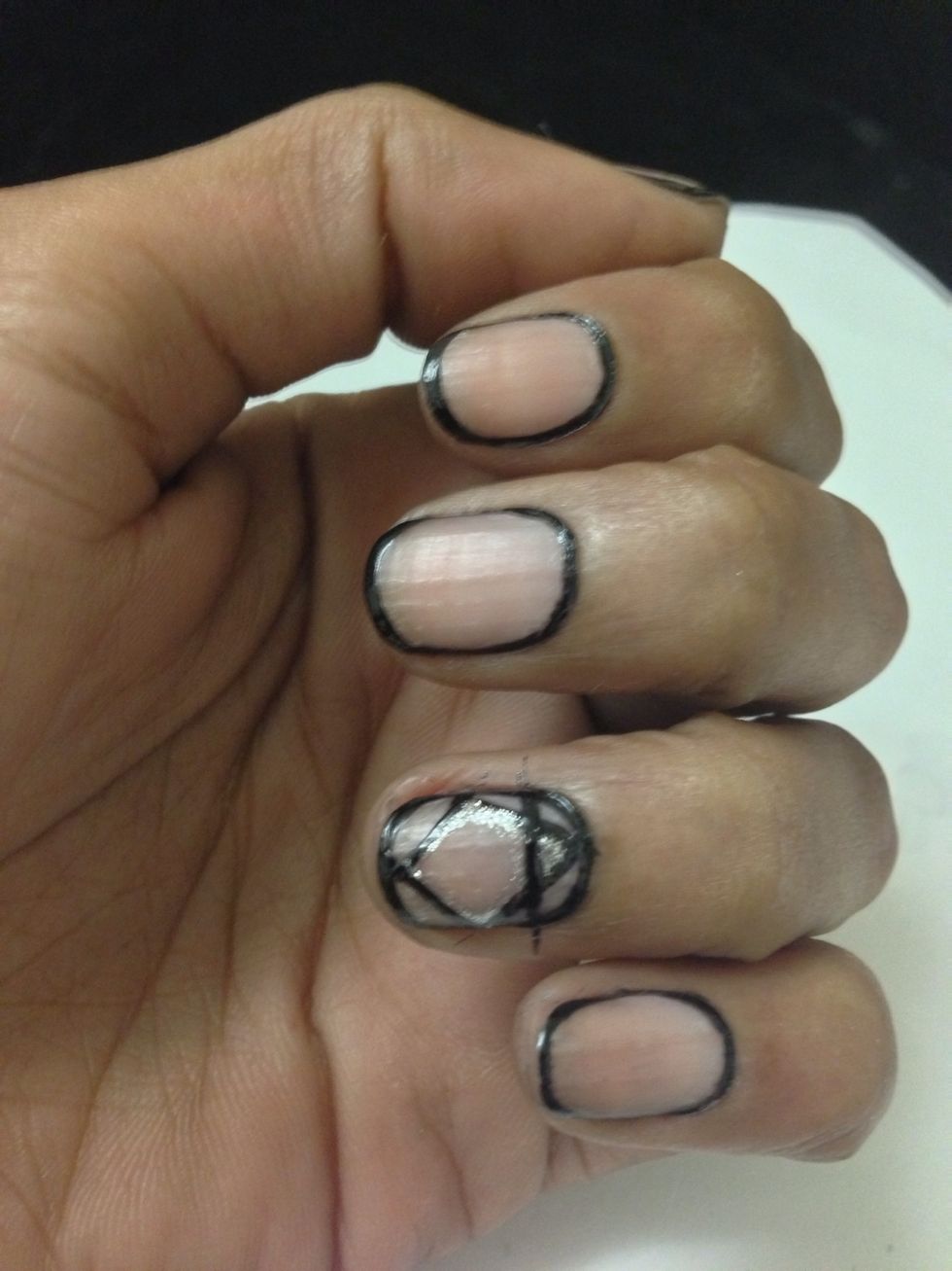Should look a bit like this. Let this dry then go back and clean up the excess paint with your nail brush and acetone or nail polish remover.