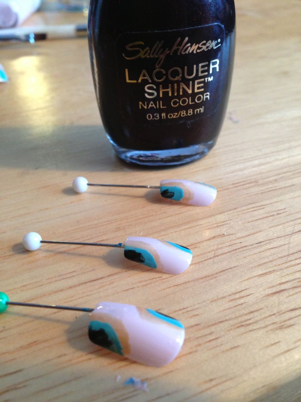 Should look like this. I used Sally Hansen Laquer Shine in 08 Glossy. It's a deep wine color that almost looks black. Again, don't worry about being perfect.