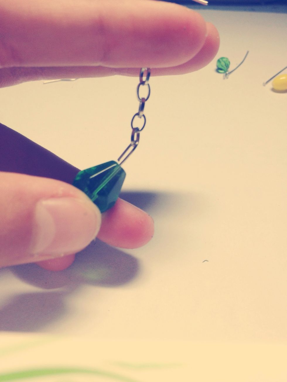 Should look like this. Make sure the metal loop is close enough together that the chain won't fit through.
