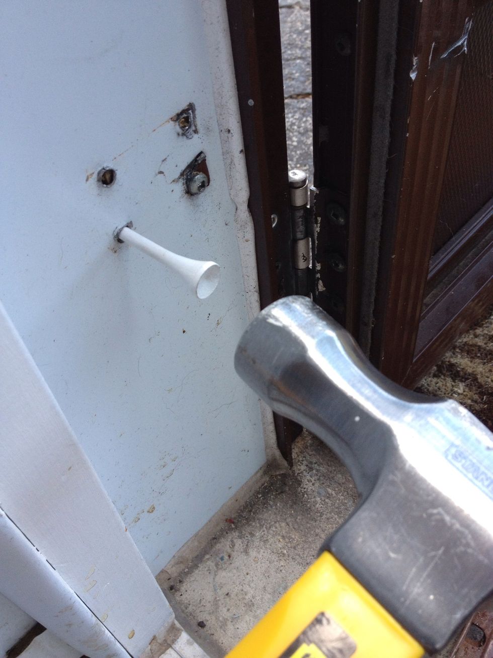 Shove a golf tee in the stripped hole. Use a hammer to get it good and deep but tap gently so you don't split the relatively soft wood of the golf tee.