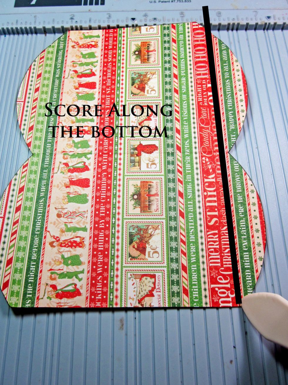 Show a straight line along the bottom as shown. This is going to make the bottom flaps of your bag and have it sit level.