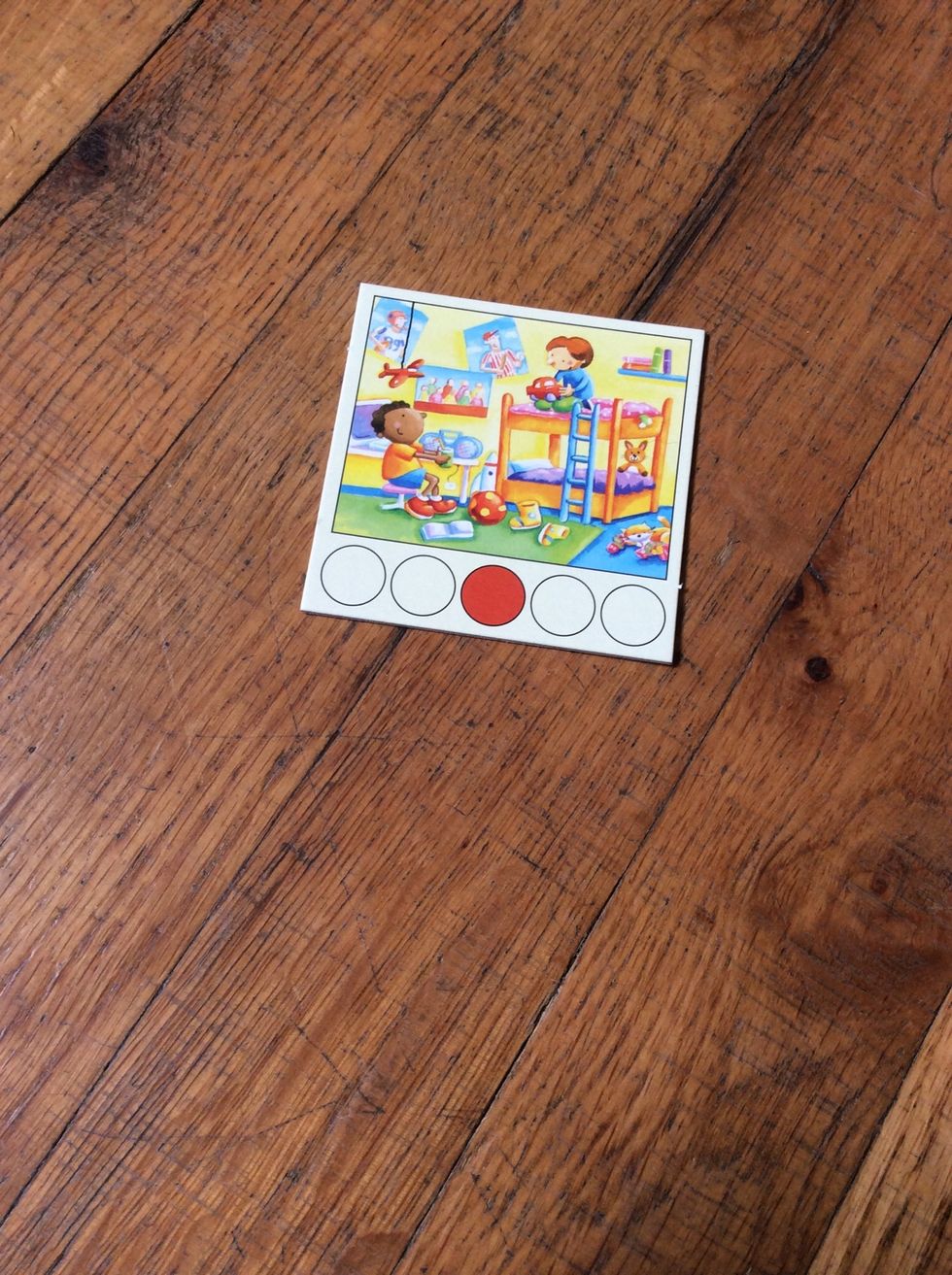 Show one Room Card and ask the learner to name items they see.