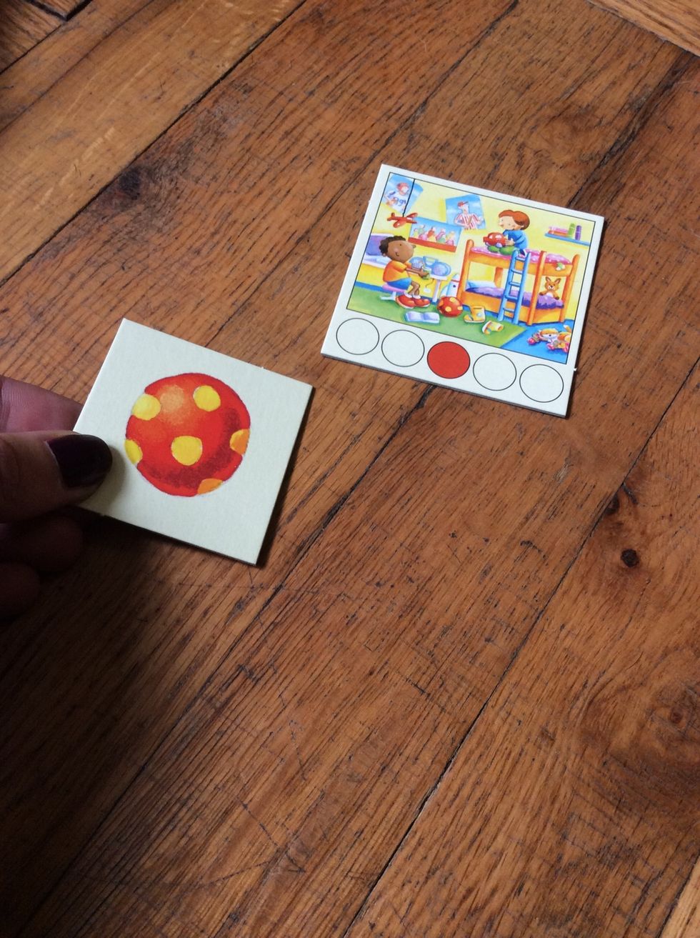 Show one Room Card, then hold up the corresponding Object Card and ask the learner to find it.