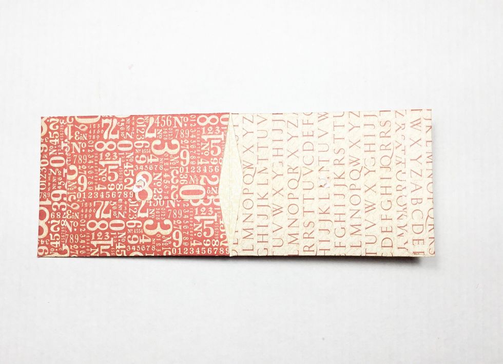 Showing red envelope glued into cream envelope to create the pages.