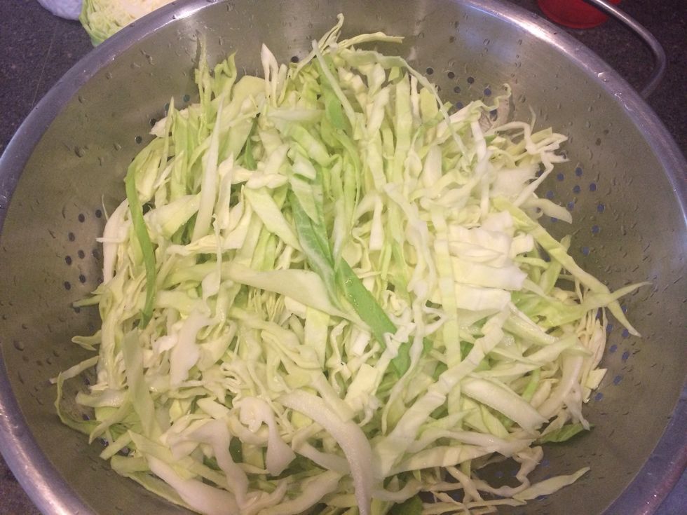 Shred 1/2 head of cabbage like this and wash