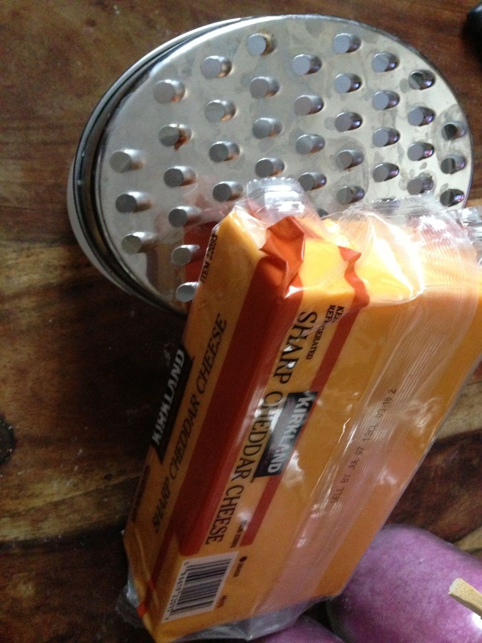 Shred 1/4 lb cheddar cheese
