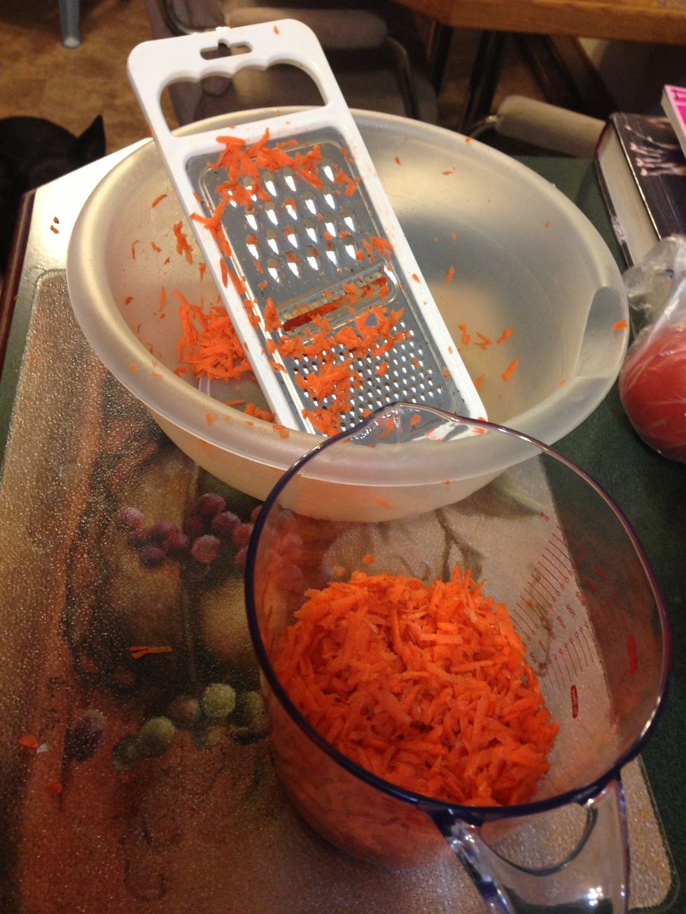 Shred 3 cups of  carrots. I do this step first because it is the most tedious part!