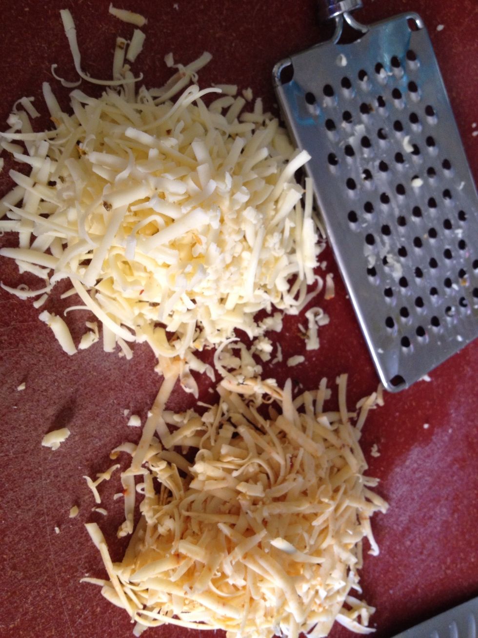 Shred cheese(s), then toss together to combine.