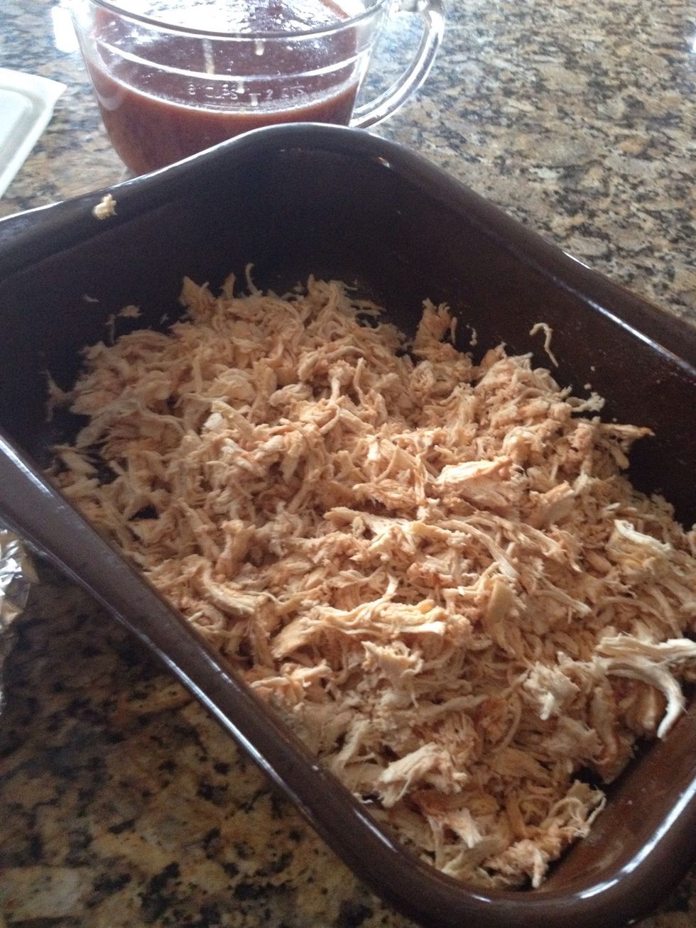 Shred chicken and mound up in roasting dish