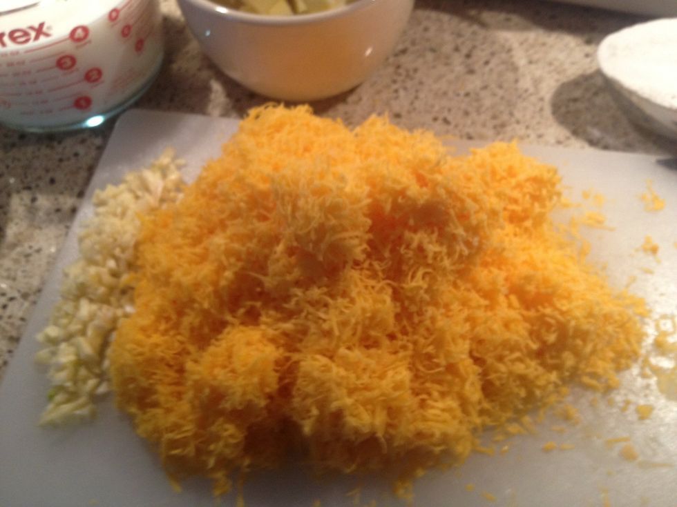 Shred extra sharp cheddar cheese.