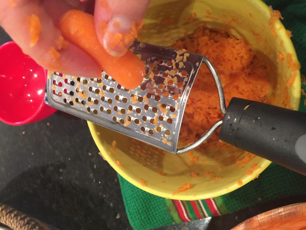 Shred the carrots using a veggie grater.